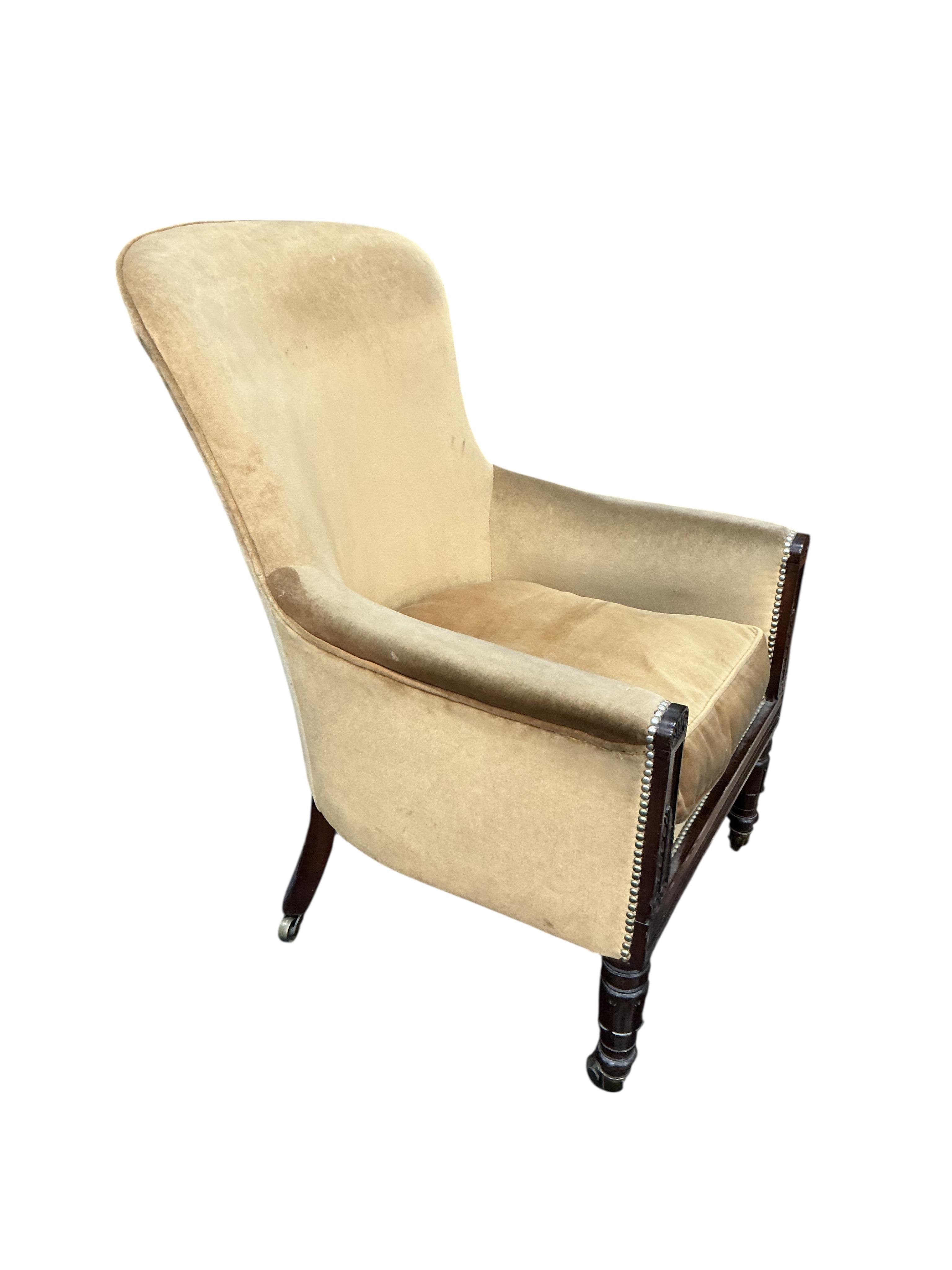 A William IV rosewood spoon back upholstered armchair, width 64cm, depth 68cm, height 104cm